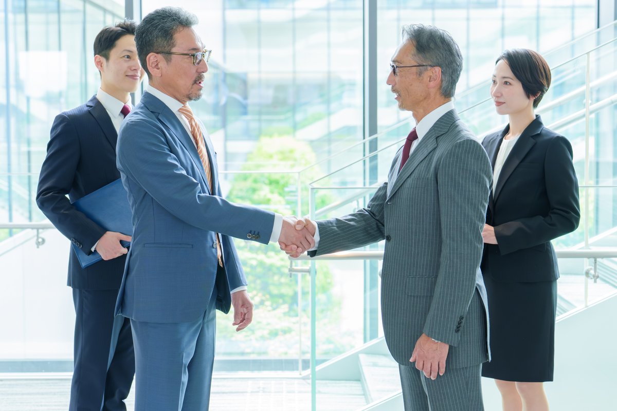 ビジネス 握手 提携 合意